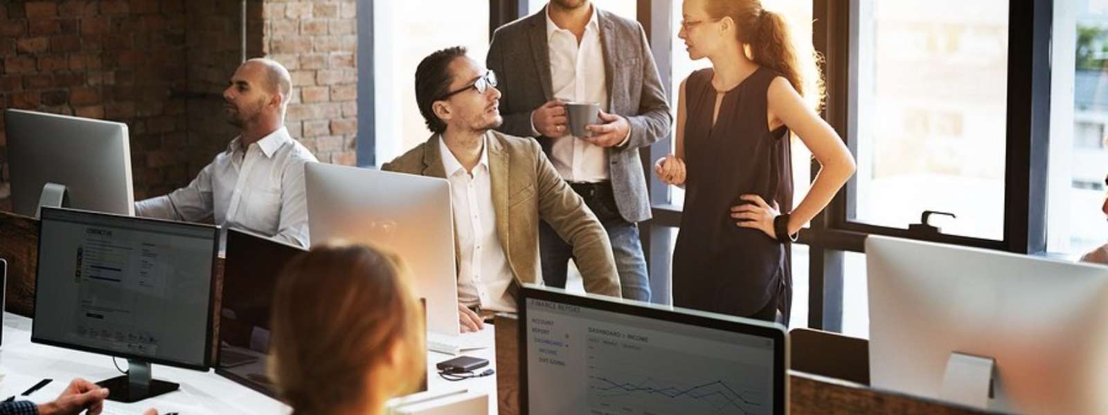 employee meeting in open workspace